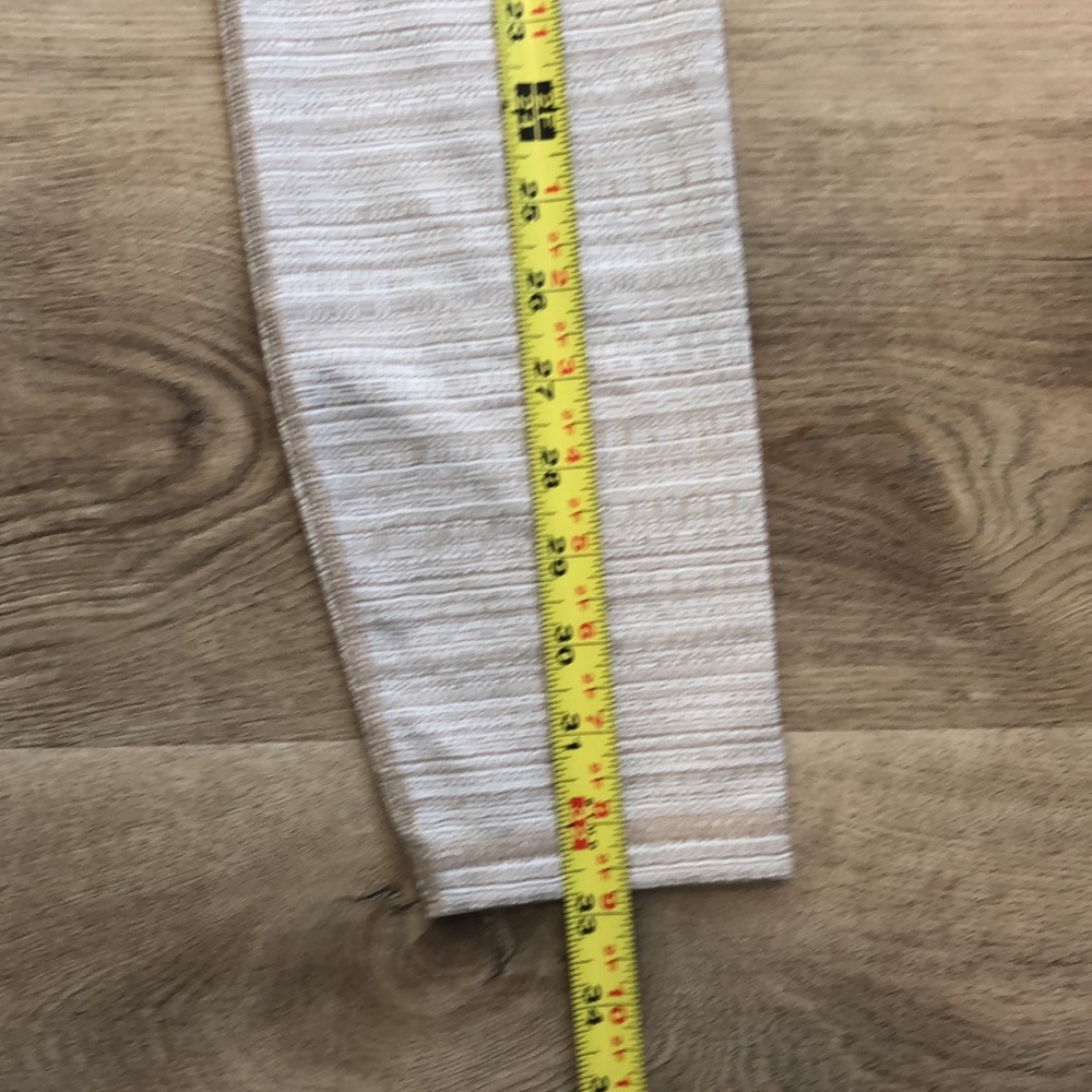 Athleta Leggings In a tan and white textured pattern. - Picture 4 of 13